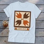 Light blue t-shirt with a "Turkey Track" quilt block design and text.