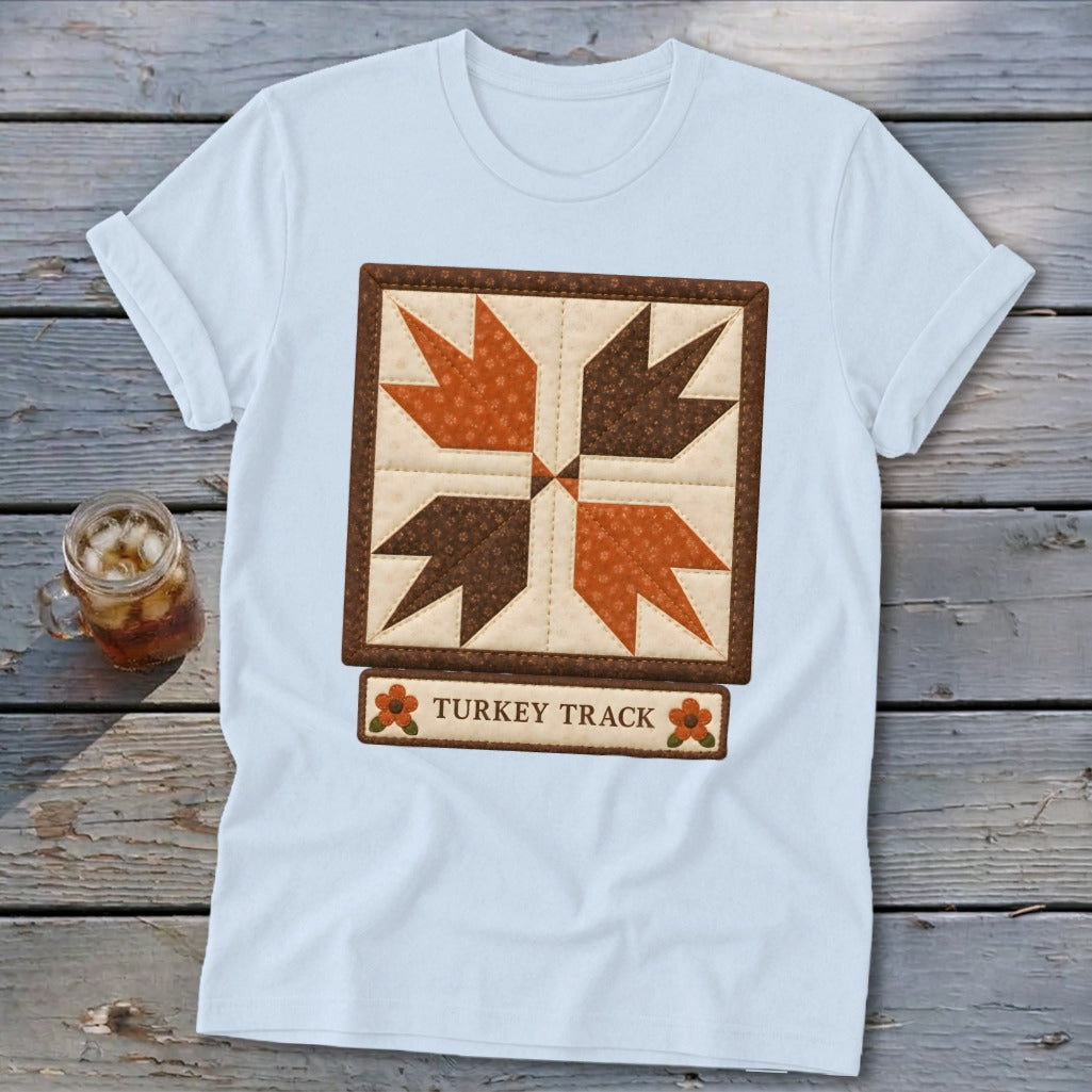 Light blue t-shirt with a "Turkey Track" quilt block design and text.