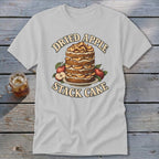 T-shirt graphic with "Dried Apple Stack Cake" text and illustration of layered cake with apples.