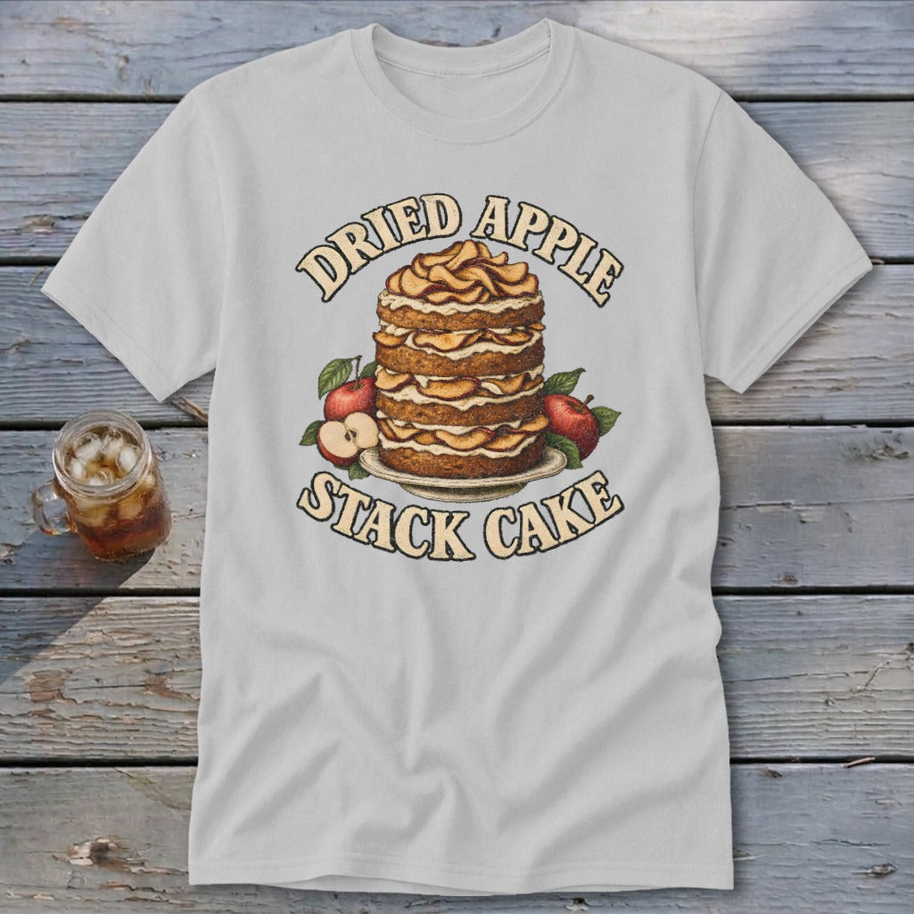 T-shirt graphic with "Dried Apple Stack Cake" text and illustration of layered cake with apples.
