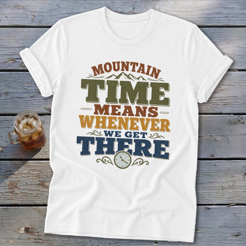 White t-shirt with "Mountain Time Means Whenever We Get There" text and clock graphic.