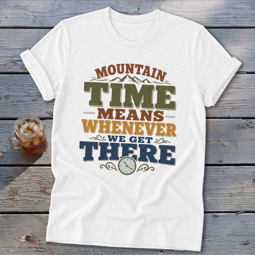 White t-shirt with "Mountain Time Means Whenever We Get There" text and clock graphic.