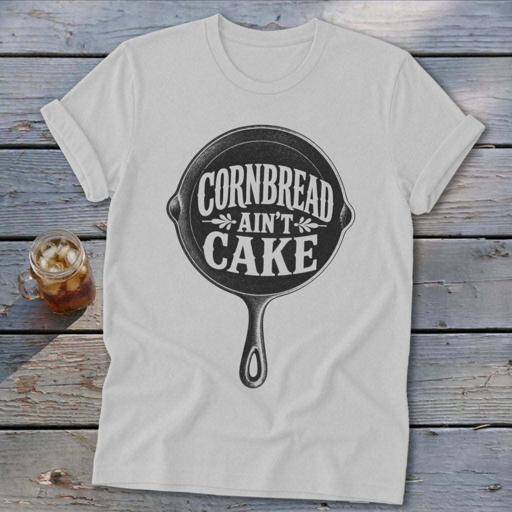White t-shirt with cast iron skillet graphic reading "Cornbread Ain't Cake".
