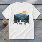 White t-shirt with "Ridge Runner Morning" text and mountain sunrise graphic.