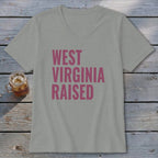 Gray v-neck t-shirt with pink text reading "WEST VIRGINIA RAISED".
