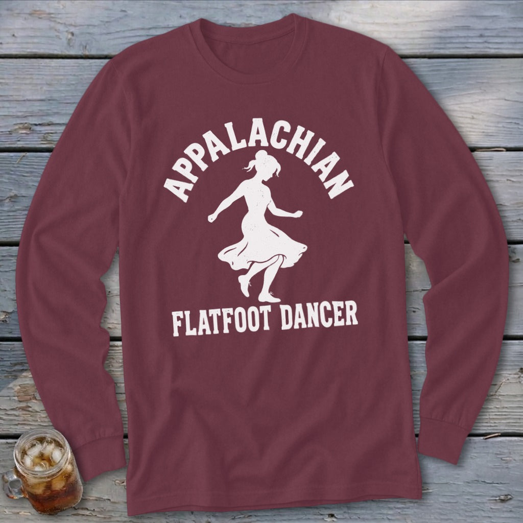 A maroon long-sleeve t-shirt with a white graphic of a dancer and the text Appalachian Flatfoot Dancer.
