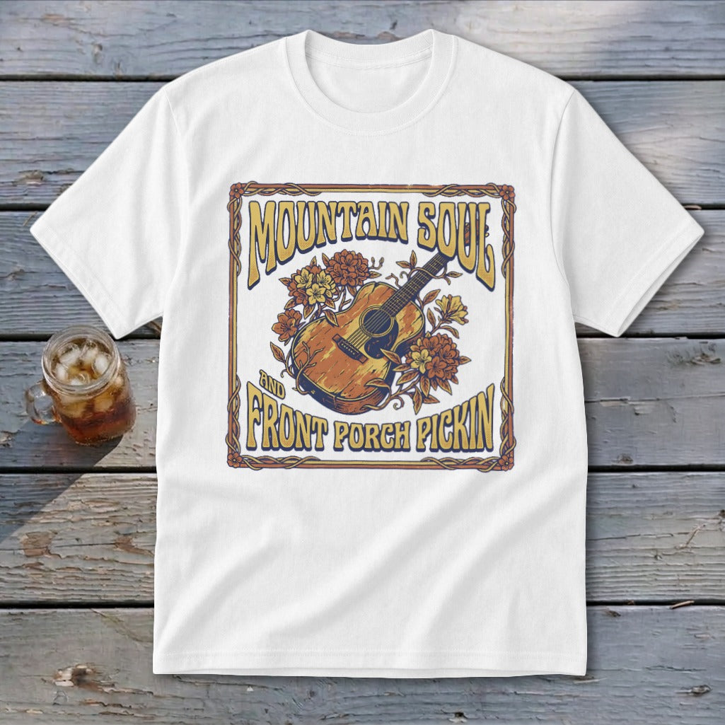 White t-shirt with "Mountain Soul and Front Porch Pickin'" text and acoustic guitar graphic.