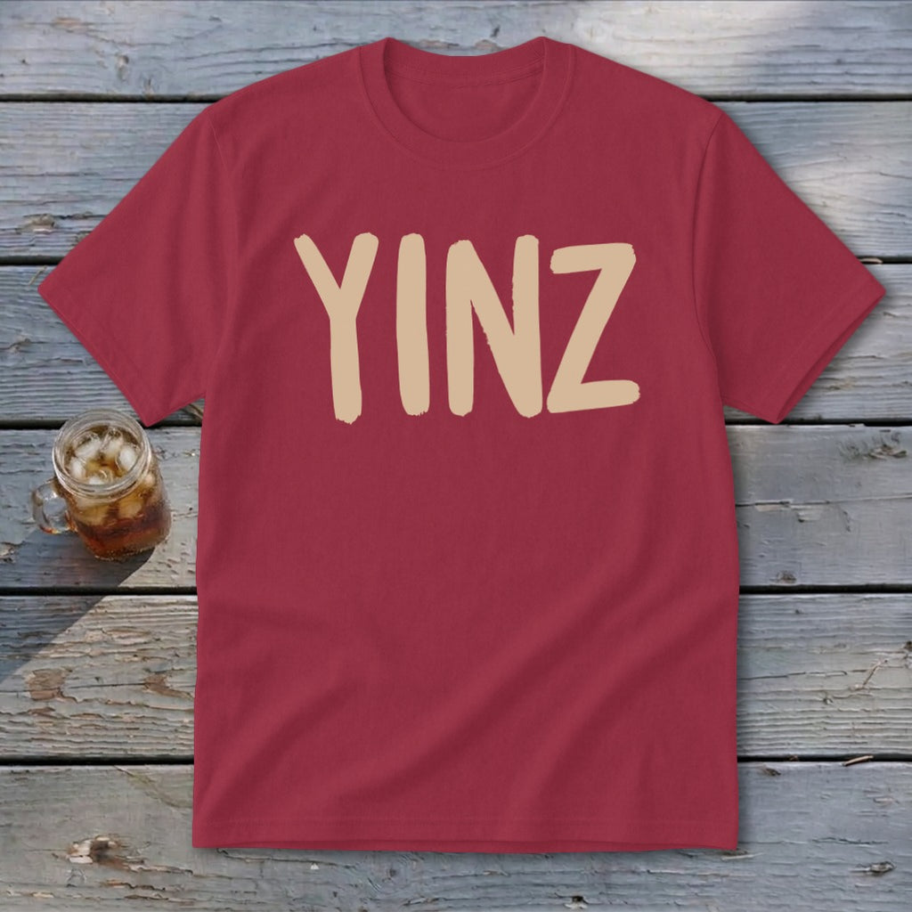 Maroon t-shirt with tan "YINZ" text.