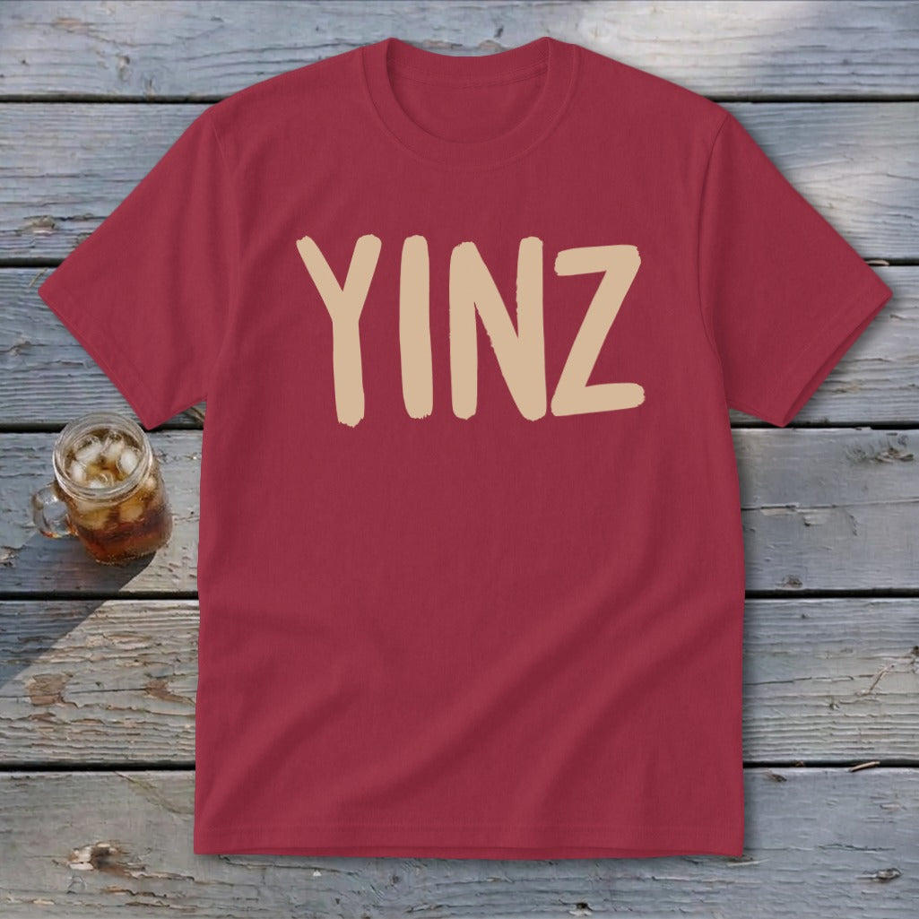 Maroon t-shirt with tan "YINZ" text.
