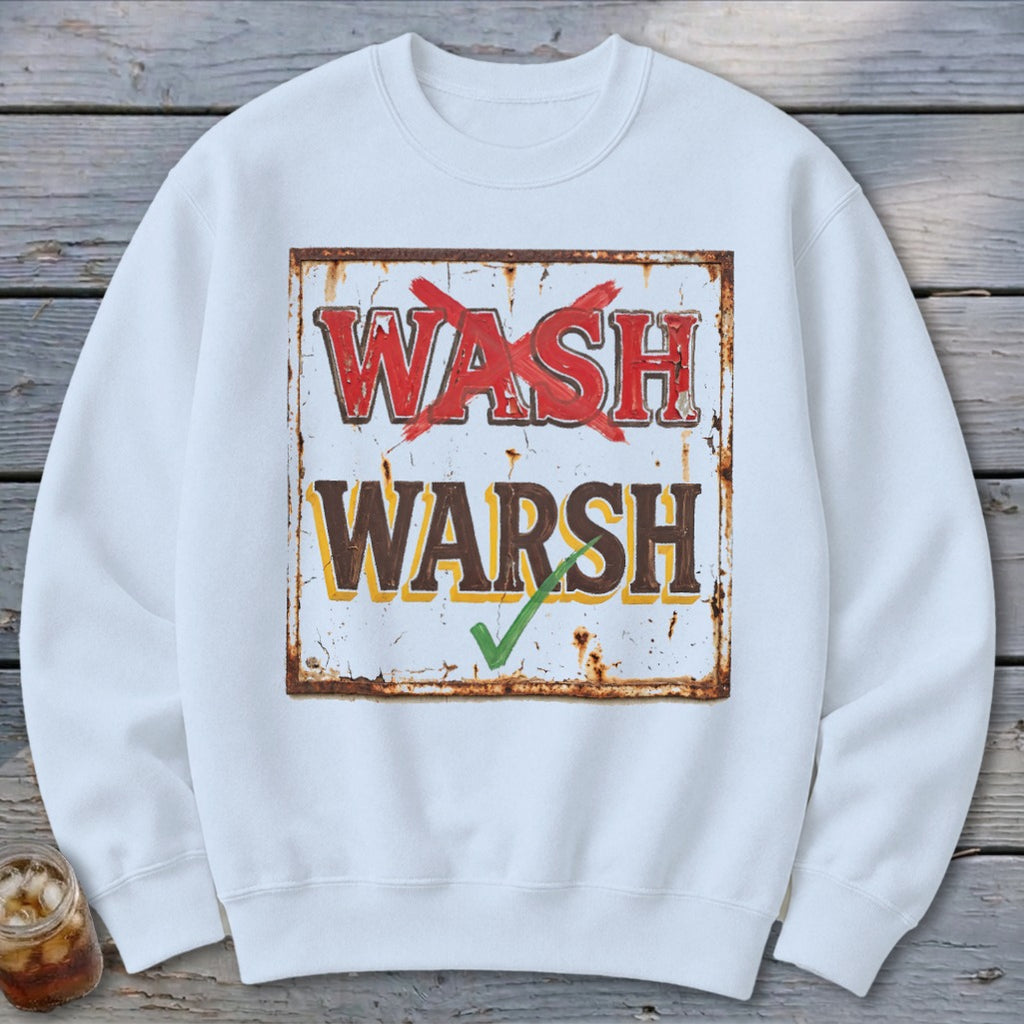 A white crewneck sweatshirt featuring a graphic of a rusty sign with the text WASH with a red X over it and WARSH with a green checkmark below.