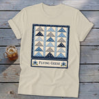Cream t-shirt with a blue and grey flying geese quilt pattern and "Flying Geese" text.