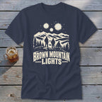Dark blue t-shirt featuring a graphic of three figures looking at mountain lights above text reading BROWN MOUNTAIN LIGHTS.
