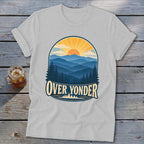 A grey t-shirt featuring a retro mountain landscape graphic with the text OVER YONDER.