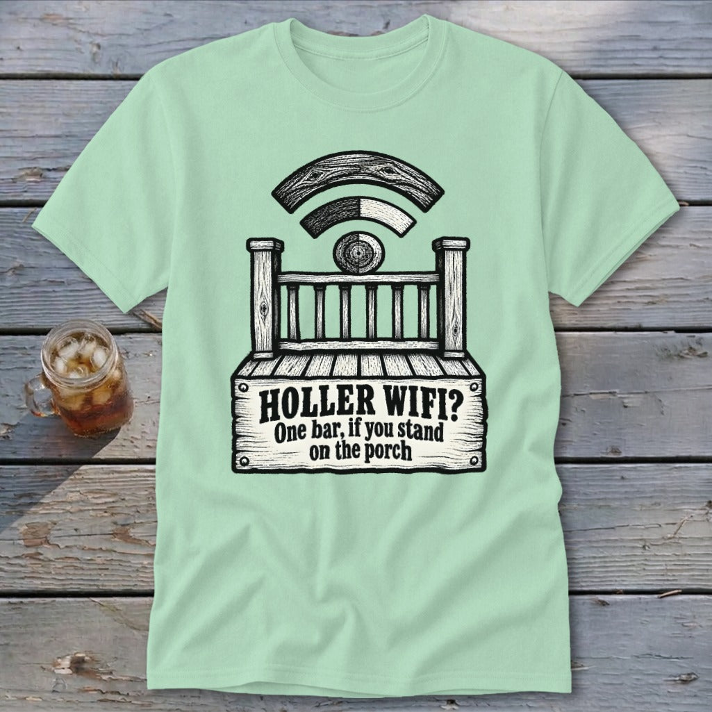 Light green t-shirt featuring a humorous graphic of a porch with a wifi symbol and text reading "Holler Wifi? One bar, if you stand on the porch".