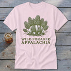 Pink t-shirt with green morel mushrooms and "Wild Foraged Appalachia" text.