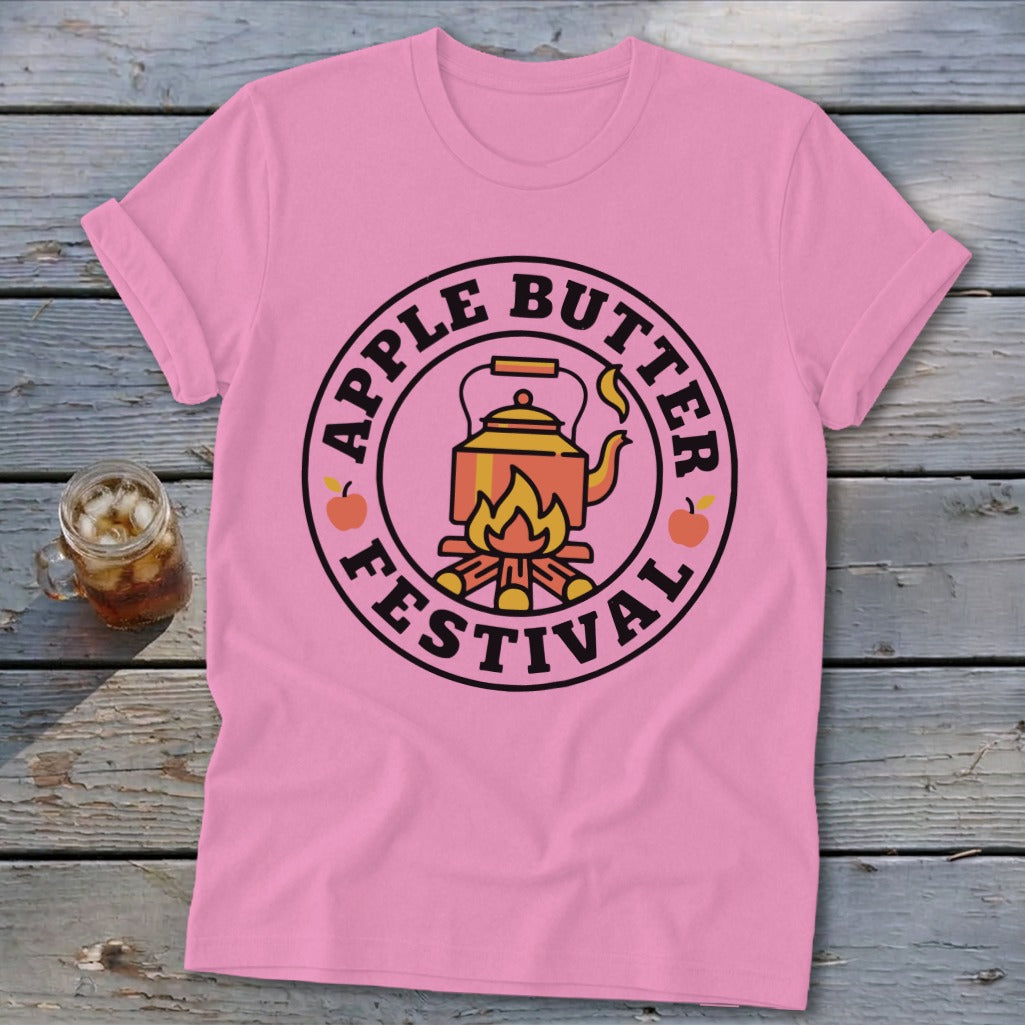 Pink t-shirt with "Apple Butter Festival" text and kettle over fire graphic.