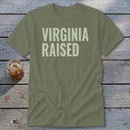 Olive green t-shirt with "Virginia Raised" text in cream.