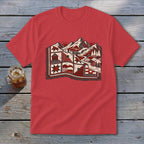 Red crewneck t-shirt featuring a stylized mountain landscape graphic in red and white on a wooden background.