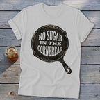 White t-shirt with a cast iron skillet graphic saying "No Sugar in the Cornbread".