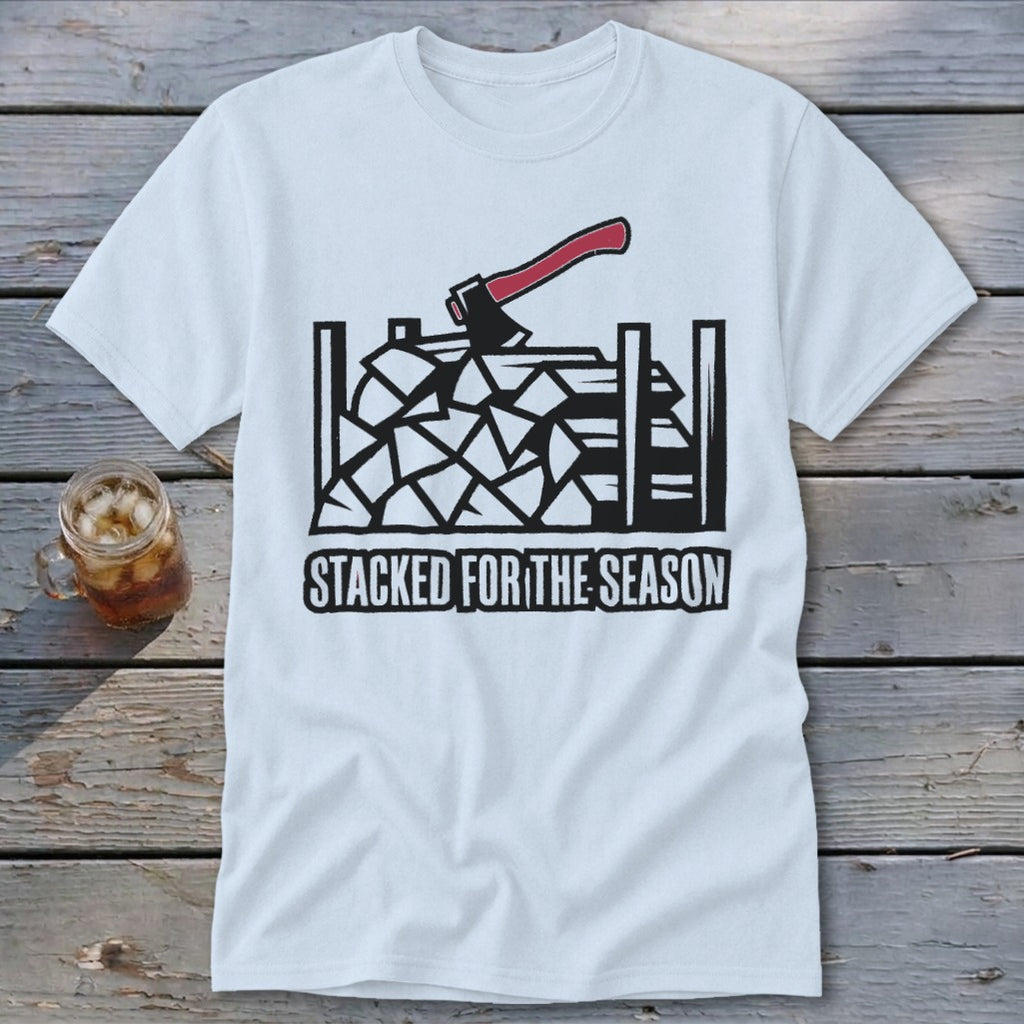 White t-shirt with graphic of firewood, axe, and text "STACKED FOR THE SEASON".