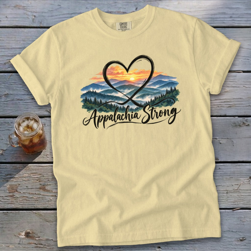 Light yellow t-shirt with "Appalachia Strong" and mountain sunset graphic inside a heart.