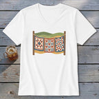 White V-neck t-shirt featuring a retro graphic of three colorful quilts hanging on a clothesline against a wooden background.