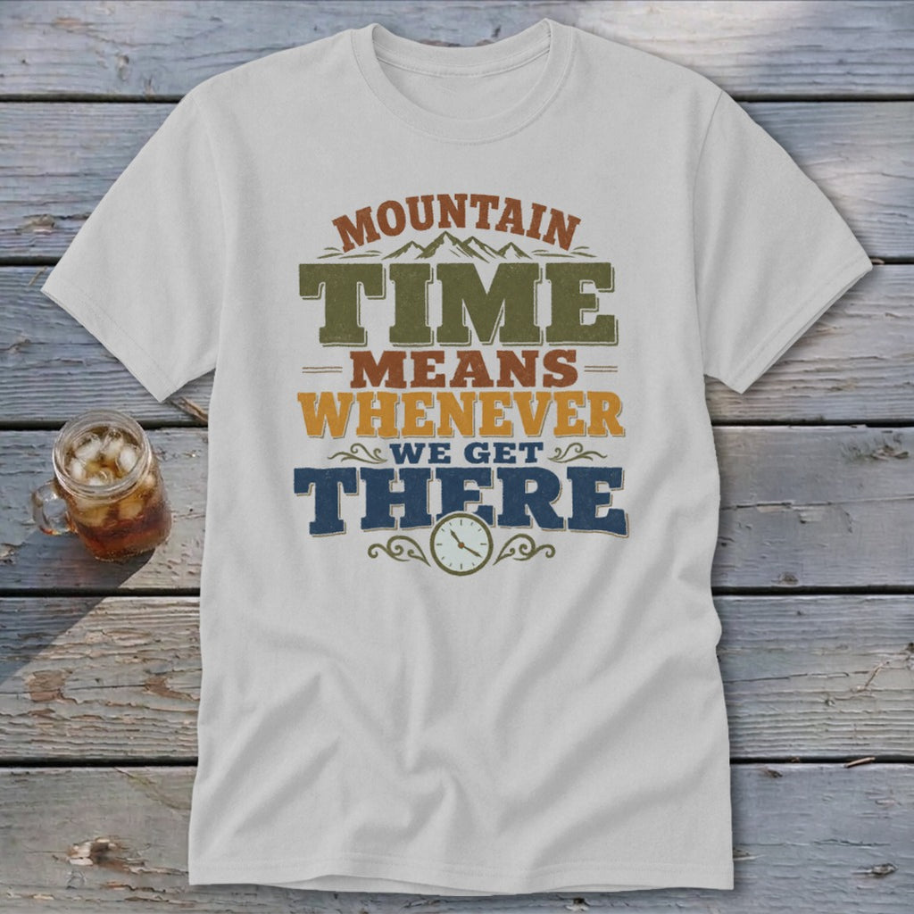 White t-shirt with "Mountain Time Means Whenever We Get There" text and clock graphic.