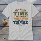 White t-shirt with "Mountain Time Means Whenever We Get There" text and clock graphic.