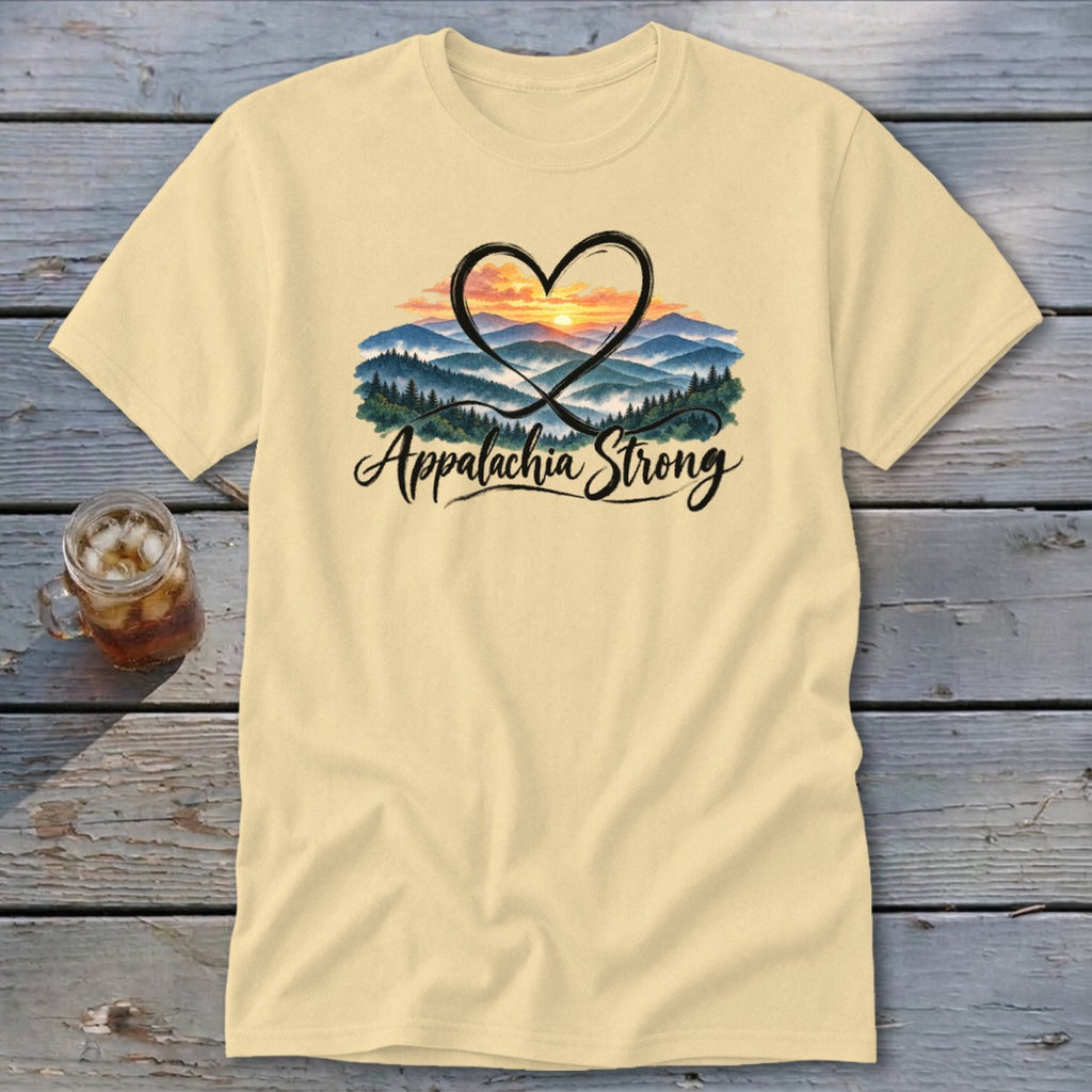 Light yellow t-shirt with a heart encompassing a mountain sunset and "Appalachia Strong" text.