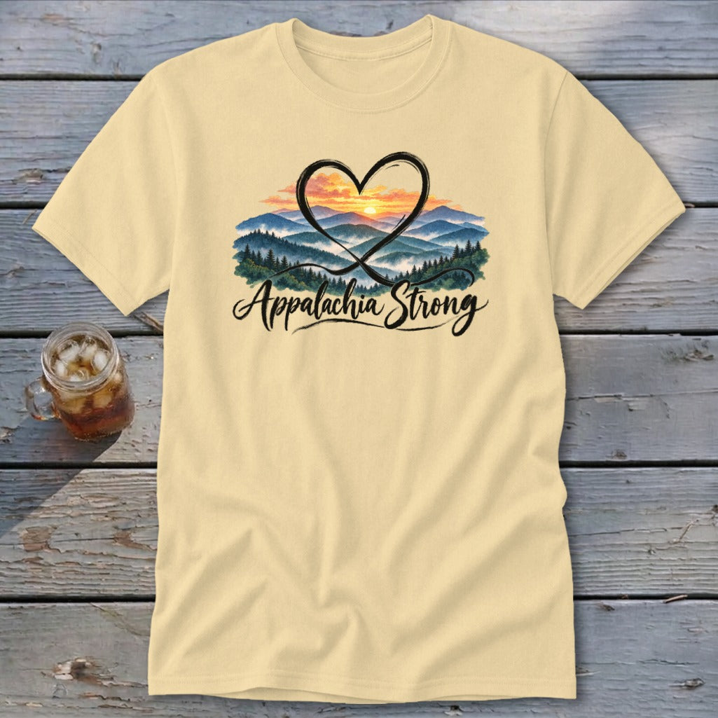 Light yellow t-shirt with a heart encompassing a mountain sunset and "Appalachia Strong" text.