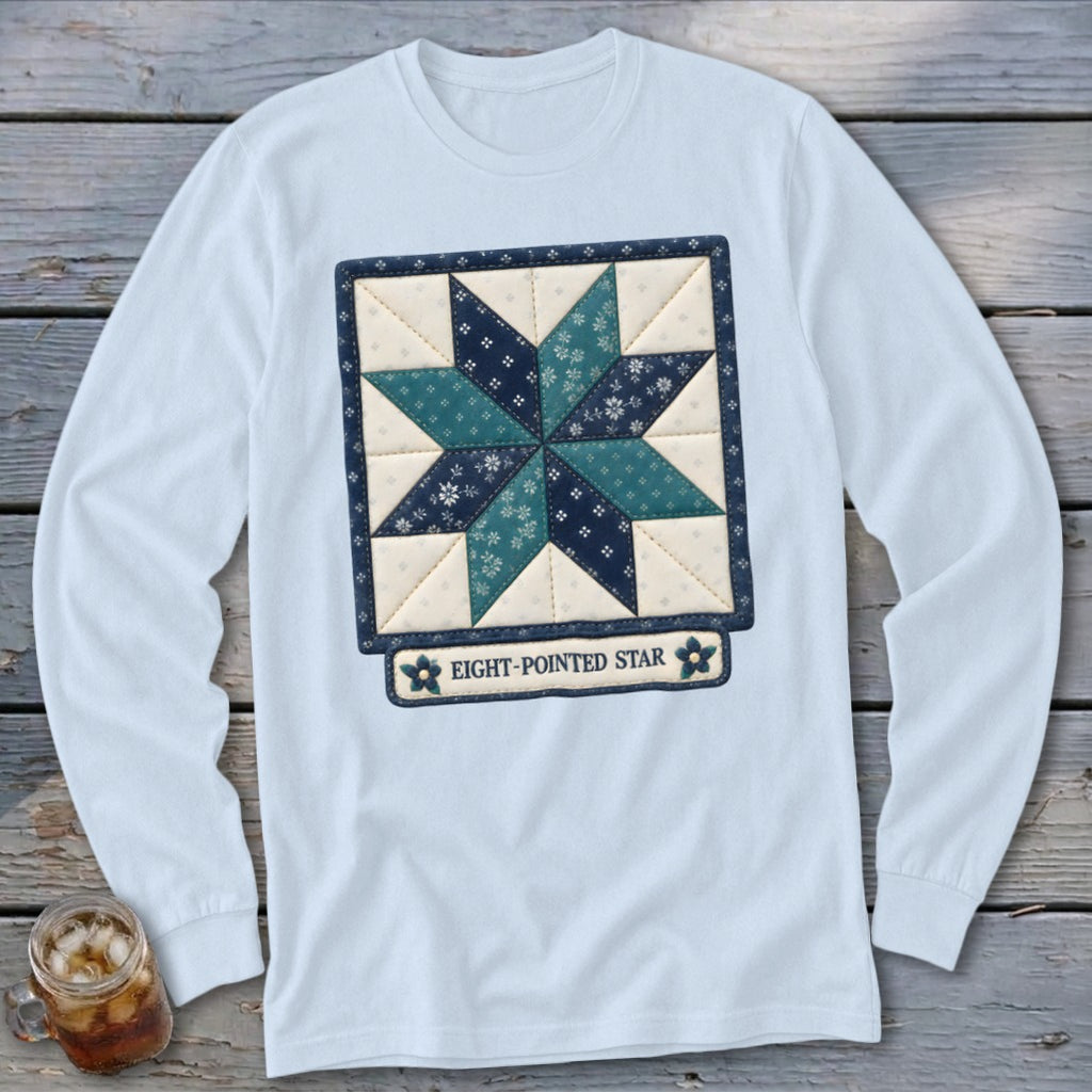 Light blue long-sleeved shirt with a quilt square design of an eight-pointed star.