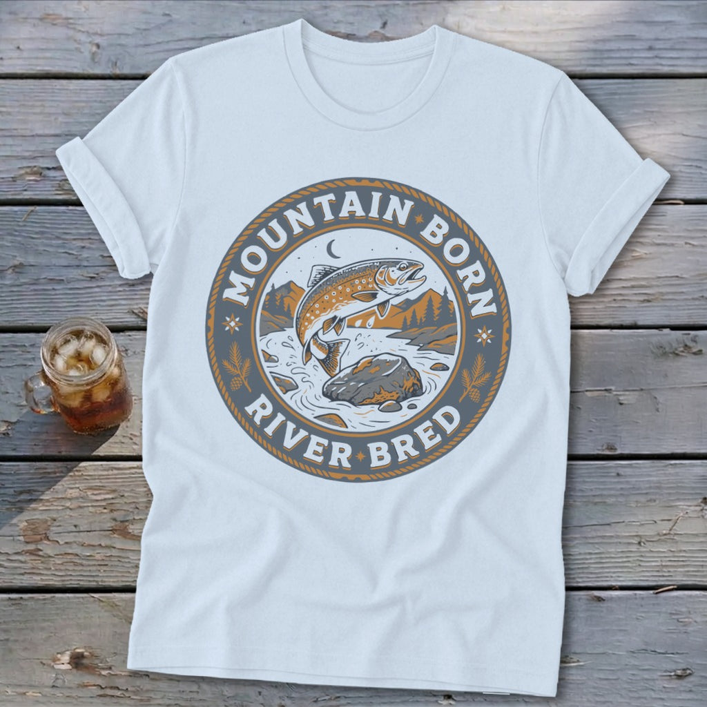 White t-shirt with "Mountain Born River Bred" text and a jumping trout graphic.