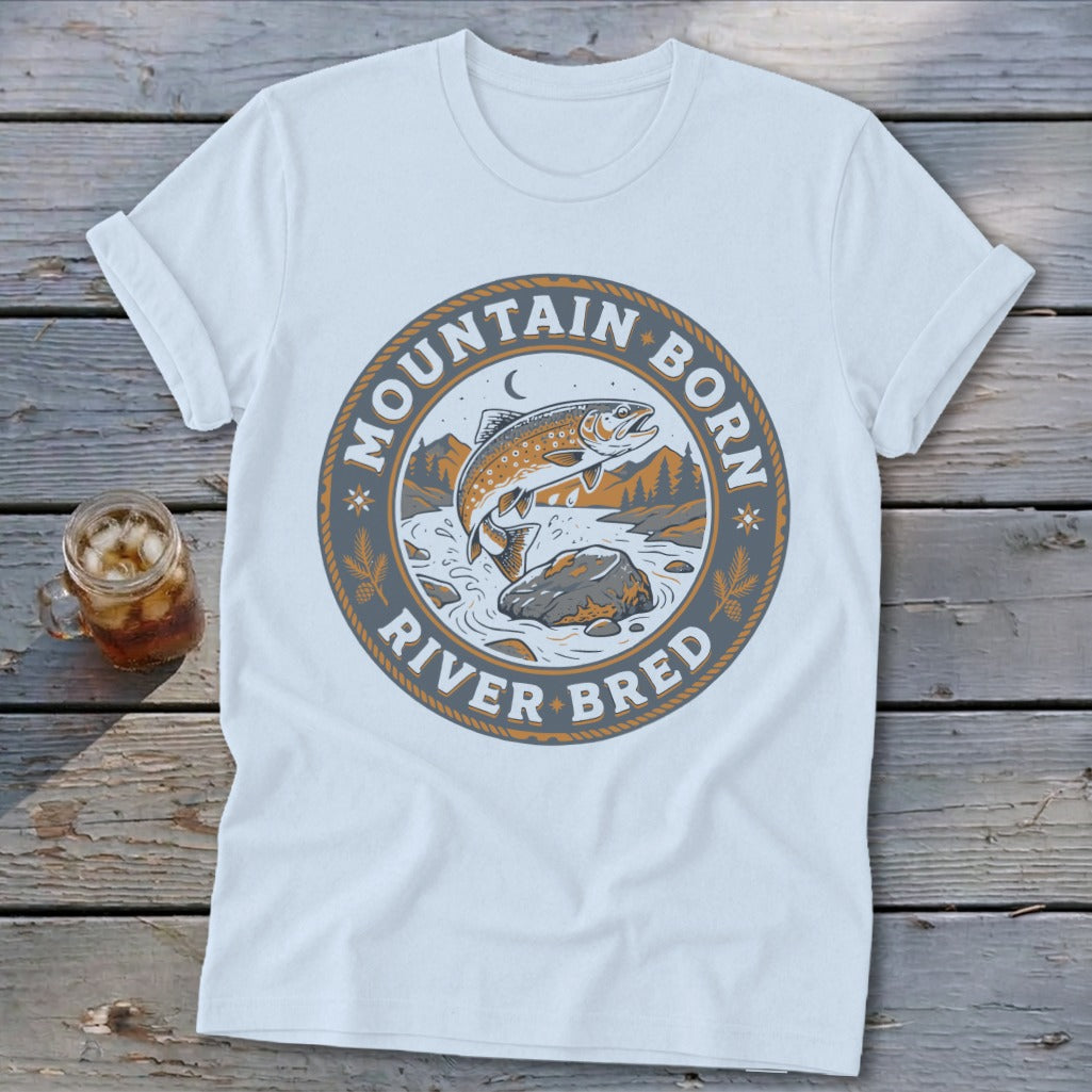 White t-shirt with "Mountain Born River Bred" text and a jumping trout graphic.