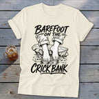 T-shirt graphic: barefoot on the crick bank text with feet in water.