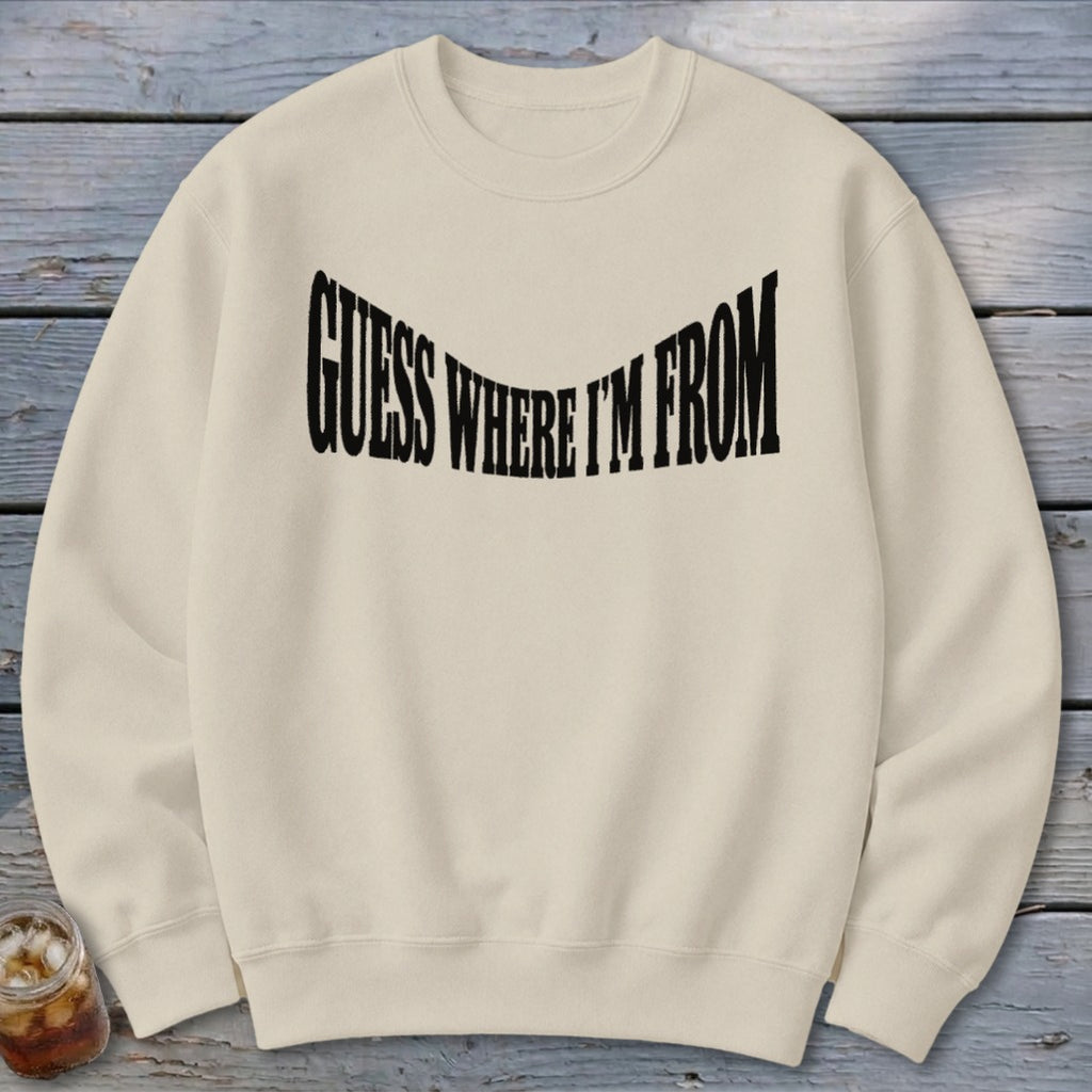 Cream sweatshirt with black "GUESS WHERE I'M FROM" text across the chest.