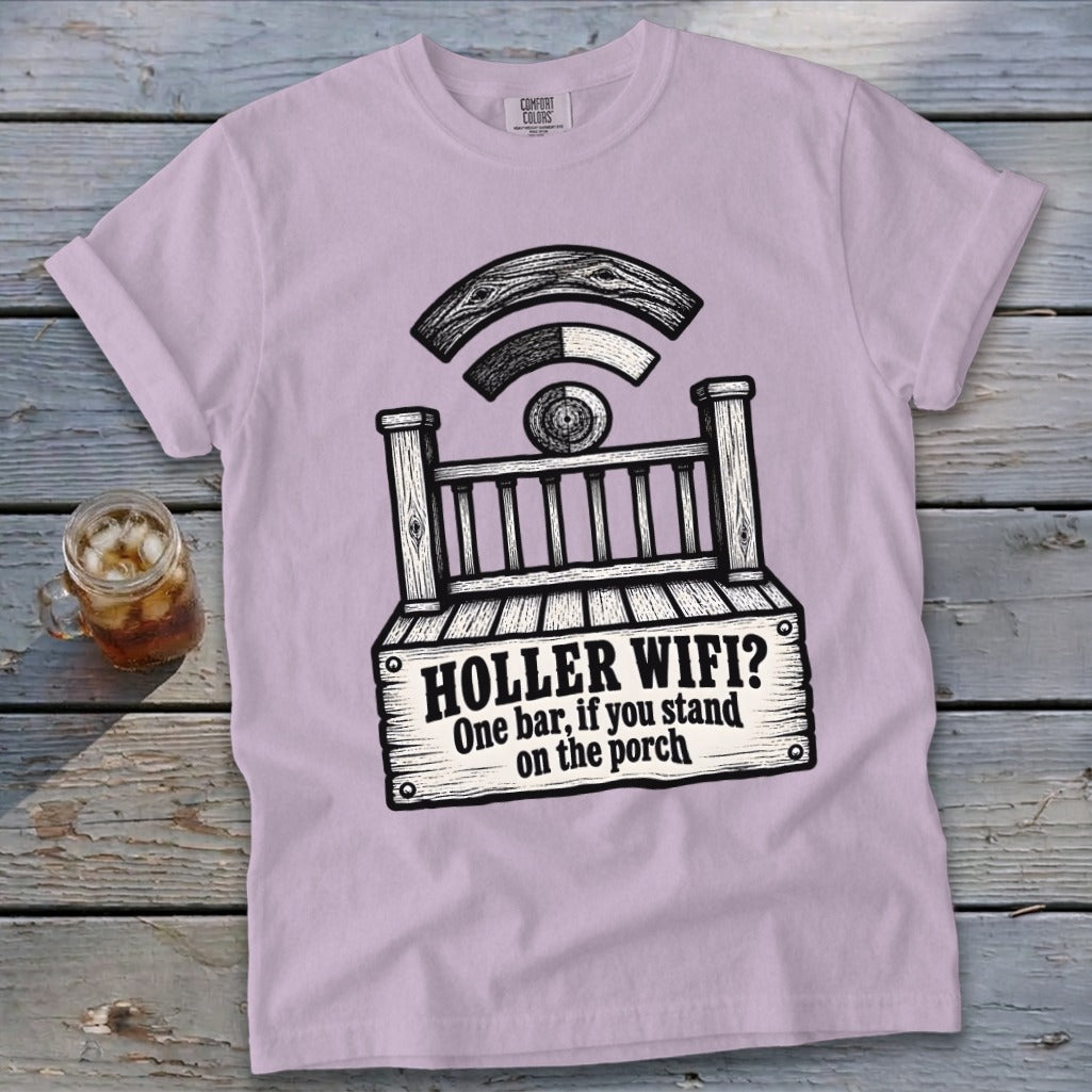 A light purple t-shirt featuring a graphic of a wooden porch and the text HOLLER WIFI? One bar, if you stand on the porch.