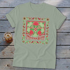 Light green t-shirt with a square red and green floral design and "Mountain Blood" text.