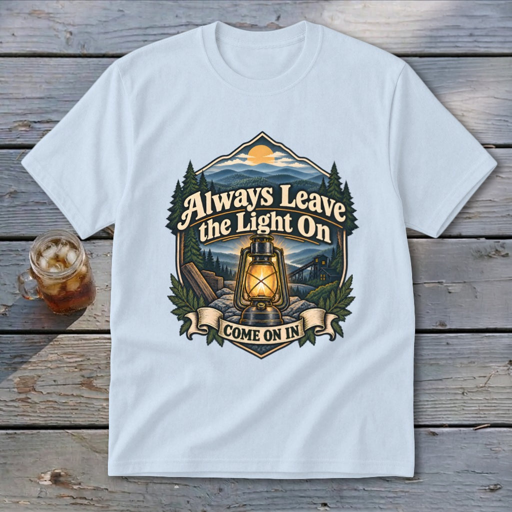 Light blue t-shirt graphic with "Always Leave the Light On Come On In" and a lantern.