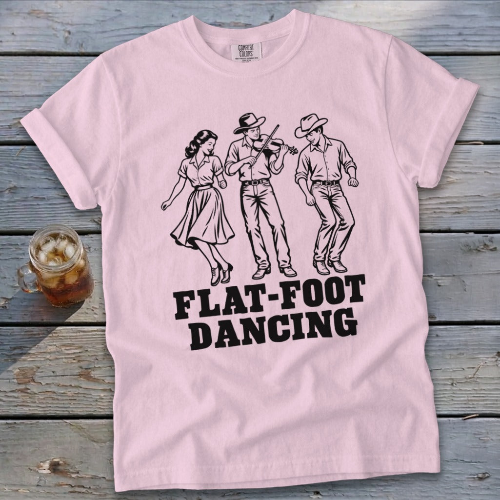 Pink t-shirt with black graphic of three people dancing and the words "FLAT-FOOT DANCING".
