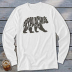 White long-sleeve t-shirt with a grey bear graphic filled with the word Appalachia on a wooden background.