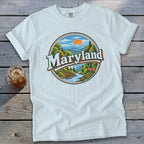 White t-shirt with circular Maryland nature graphic featuring a deer and river.