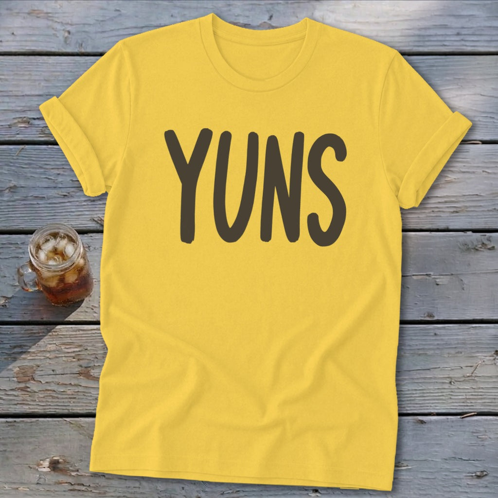 Yellow t-shirt with dark brown text that says "YUNS".