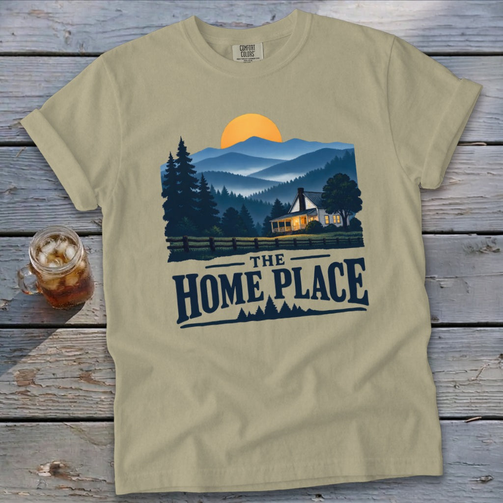 Khaki t-shirt with "The Home Place" text and a scenic mountain home illustration.