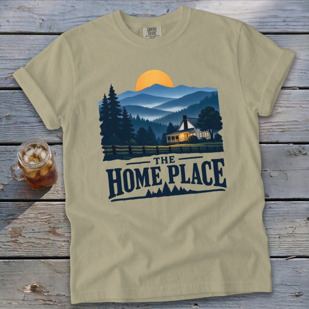 Khaki t-shirt with "The Home Place" text and a scenic mountain home illustration.