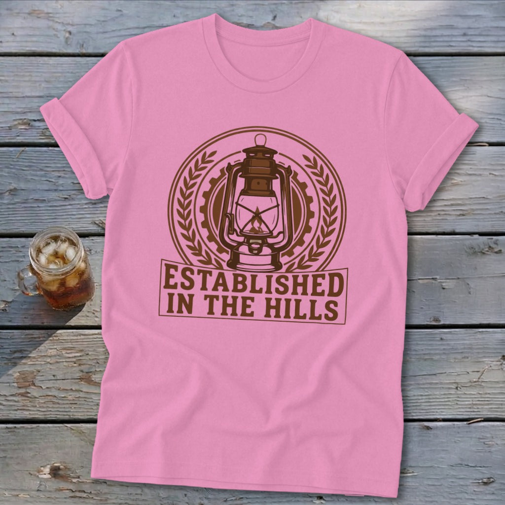 Pink t-shirt with brown "Established in the Hills" text and lantern graphic.