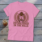 Pink t-shirt with brown "Established in the Hills" text and lantern graphic.