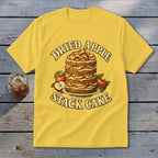 Yellow t-shirt graphic featuring a stack cake with apples and text "Dried Apple Stack Cake."
