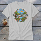 White t-shirt with round graphic of a deer by a river in Tennessee mountains.