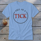 Light blue t-shirt with "FULL AS A TICK" graphic in black and red.