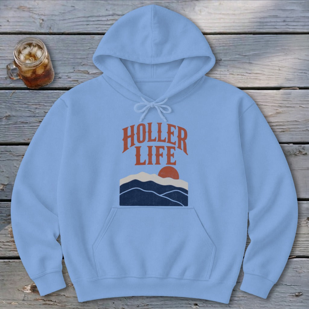 Light blue hooded sweatshirt featuring the orange text HOLLER LIFE above a sunset mountain graphic.
